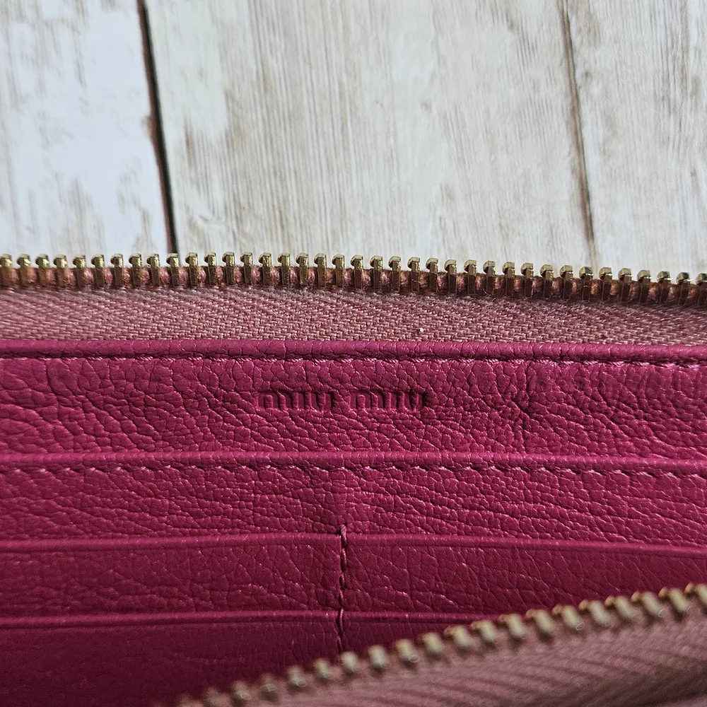 Miu Miu Pink Wallet with Elegant Zip Closure